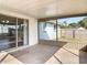 Screened patio with backyard views and a glimpse of the house next door at 1276 Comerwood Dr, Deltona, FL 32738