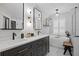 Stylish bathroom featuring dual sinks and a luxurious freestanding tub at 1301 Johns Cove Ln, Oakland, FL 34787