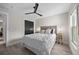 Comfortable bedroom featuring a ceiling fan, ample natural light, and closet storage at 1301 Johns Cove Ln, Oakland, FL 34787