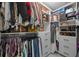 Organized walk-in closet featuring custom shelving and ample storage for clothes and accessories at 1301 Johns Cove Ln, Oakland, FL 34787
