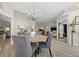 Charming dining area with a round table, chandelier, and open access to other living spaces at 1301 Johns Cove Ln, Oakland, FL 34787