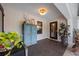 Welcoming entryway with stylish tile flooring, cabinet storage, and glass paneled door leading to outdoor living space at 1301 Johns Cove Ln, Oakland, FL 34787