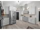 Contemporary kitchen featuring stainless steel appliances, stylish cabinetry, and ample counter space at 1301 Johns Cove Ln, Oakland, FL 34787