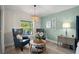 Sitting area with comfortable chairs in the main bedroom, providing a relaxing retreat at 1301 Johns Cove Ln, Oakland, FL 34787