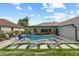 Beautiful backyard pool area with comfortable lounge chairs and a covered patio with an outdoor dining set at 1301 Johns Cove Ln, Oakland, FL 34787