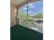 Screened balcony with a view of palm trees at 13512 Turtle Marsh Loop # 729, Orlando, FL 32837