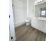 Bathroom featuring a shower-tub combo, white tile, and a white vanity at 13512 Turtle Marsh Loop # 729, Orlando, FL 32837