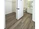Bright bathroom and walk-in closet with new floors for a modern look at 13512 Turtle Marsh Loop # 729, Orlando, FL 32837