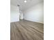 Bright bedroom with luxury vinyl plank flooring and fresh white walls at 13512 Turtle Marsh Loop # 729, Orlando, FL 32837