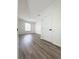 A light-filled bedroom with wood-look flooring and a double-hung window at 13512 Turtle Marsh Loop # 729, Orlando, FL 32837