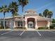 Community clubhouse featuring an arched entrance, neutral paint, and well maintained landscaping at 13512 Turtle Marsh Loop # 729, Orlando, FL 32837