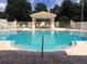 Gorgeous community pool with a lounging area, and surrounded by a secure fence at 13512 Turtle Marsh Loop # 729, Orlando, FL 32837