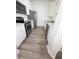 A modern kitchen with stainless steel appliances and white cabinets at 13512 Turtle Marsh Loop # 729, Orlando, FL 32837