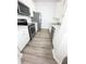 A modern kitchen with stainless steel appliances and white cabinets at 13512 Turtle Marsh Loop # 729, Orlando, FL 32837