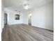 Bright living room featuring new floors and neutral paint for a modern look at 13512 Turtle Marsh Loop # 729, Orlando, FL 32837