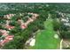 Expansive aerial view of community with golf course, mature trees, and beautiful homes at 1364 Augusta National Blvd, Winter Springs, FL 32708