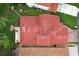 Overhead view of a house with a red tile roof and well-maintained landscaping at 1364 Augusta National Blvd, Winter Springs, FL 32708