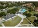 Beautiful aerial view of community clubhouse, pool, tennis courts, and golf course at 1364 Augusta National Blvd, Winter Springs, FL 32708