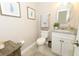 Charming powder room with decorative mirror, granite countertop and neutral paint at 1364 Augusta National Blvd, Winter Springs, FL 32708