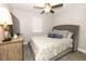 Cozy bedroom featuring a comfortable bed, ceiling fan, and ample natural light at 1364 Augusta National Blvd, Winter Springs, FL 32708