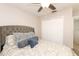 Bedroom featuring a comfortable bed, ceiling fan, and double-door closet at 1364 Augusta National Blvd, Winter Springs, FL 32708