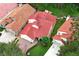 Aerial view of a charming home featuring a red tile roof and meticulous landscaping at 1364 Augusta National Blvd, Winter Springs, FL 32708
