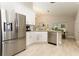 Bright kitchen featuring stainless steel appliances, granite countertops and views to dining area at 1364 Augusta National Blvd, Winter Springs, FL 32708