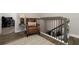A cozy second floor landing area with luxury vinyl plank flooring and an open doorway at 1364 Augusta National Blvd, Winter Springs, FL 32708