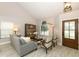 Bright living room featuring stylish seating, lots of light, and modern decor at 1364 Augusta National Blvd, Winter Springs, FL 32708