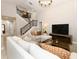 Comfortable living room with a staircase, modern furniture and an open floor plan at 1364 Augusta National Blvd, Winter Springs, FL 32708