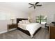 Spacious main bedroom with a ceiling fan and large window at 1364 Augusta National Blvd, Winter Springs, FL 32708