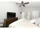 Main bedroom with ceiling fan and ensuite bathroom entrances at 1364 Augusta National Blvd, Winter Springs, FL 32708