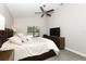 Comfortable main bedroom with a ceiling fan and dresser at 1364 Augusta National Blvd, Winter Springs, FL 32708