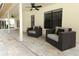 Inviting patio area with comfortable armchairs, perfect for outdoor relaxation and entertaining at 1364 Augusta National Blvd, Winter Springs, FL 32708