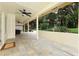 Expansive covered patio overlooking the landscaped backyard and lush greenery at 1364 Augusta National Blvd, Winter Springs, FL 32708