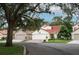 Charming street view of homes with red tile roofs and manicured lawns at 1364 Augusta National Blvd, Winter Springs, FL 32708