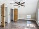 Bedroom featuring wood floors, natural light from windows, and convenient closet space at 1504 Indiana Ave, St Cloud, FL 34769