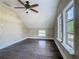 View of an empty bedroom, showing the ceiling fan and natural light from multiple windows at 1504 Indiana Ave, St Cloud, FL 34769
