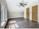 Bedroom features wood floors, natural light from windows, and two convenient closets at 1504 Indiana Ave, St Cloud, FL 34769