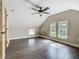 Bedroom features wood floors, ceiling fan, natural light, and convenient access to other rooms at 1504 Indiana Ave, St Cloud, FL 34769