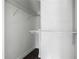 Empty walk-in closet with white walls, shelving and dark wood floor at 1504 Indiana Ave, St Cloud, FL 34769