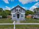 Charming gray two-story home with a well-kept front lawn and a covered entryway for curb appeal at 1504 Indiana Ave, St Cloud, FL 34769