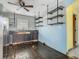 Kitchen with dark wood cabinets, stainless appliances, and decorative shelving ready to be transformed at 1504 Indiana Ave, St Cloud, FL 34769