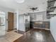 Kitchen featuring stainless steel refrigerator, modern appliances, and ample renovation potential at 1504 Indiana Ave, St Cloud, FL 34769