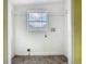 Unfinished laundry room with exposed plumbing and electrical and a window at 1504 Indiana Ave, St Cloud, FL 34769