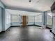 Bright living room featuring hardwood floors, multiple windows, and ample space at 1504 Indiana Ave, St Cloud, FL 34769