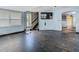 Renovation-ready living room with original wood floors and staircase access at 1504 Indiana Ave, St Cloud, FL 34769