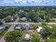 Aerial view of a quiet neighborhood showing streets, houses, mature trees and backyard sheds at 1504 Indiana Ave, St Cloud, FL 34769