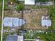 Aerial view of the neighborhood showing surrounding houses and mature trees at 1504 Indiana Ave, St Cloud, FL 34769
