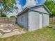 The shed is made of concrete blocks and has a white door at 1504 Indiana Ave, St Cloud, FL 34769